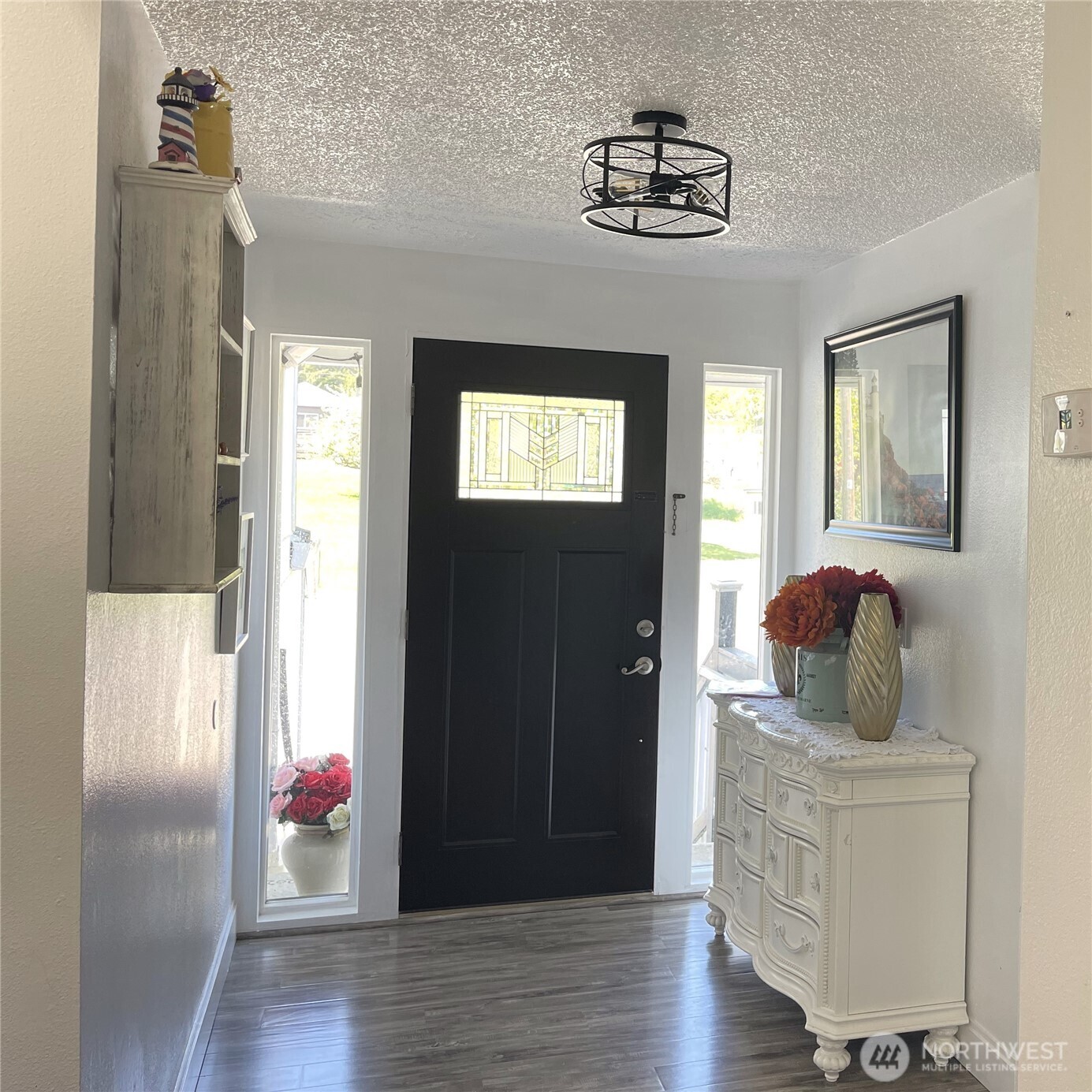 1017 Ballentine Street Raymond, WA 98577 - Photo 10 of 30 a room that has a window and wooden floor