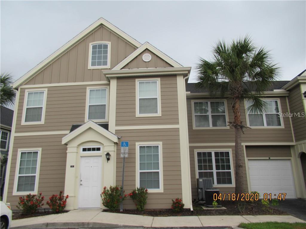 5531 Rosehill Road, Unit 101 Sarasota, FL 34233 - Photo 1 of 1 a front view of a house with a yard