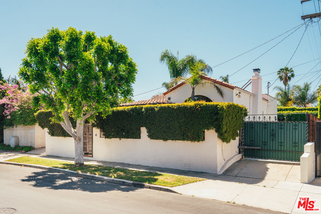 8060 Clinton Street Los Angeles, CA 90048 - Photo 1 of 8 a front view of a house with a yard