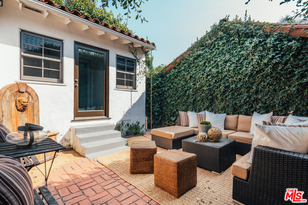 8060 Clinton Street Los Angeles, CA 90048 - Photo 3 of 8 a view of a patio with couches and potted plants