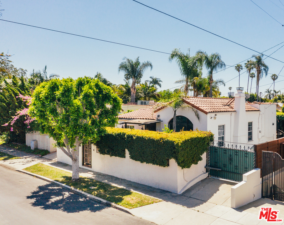 8060 Clinton Street Los Angeles, CA 90048 - Photo 8 of 8 a front view of a house with a swimming pool