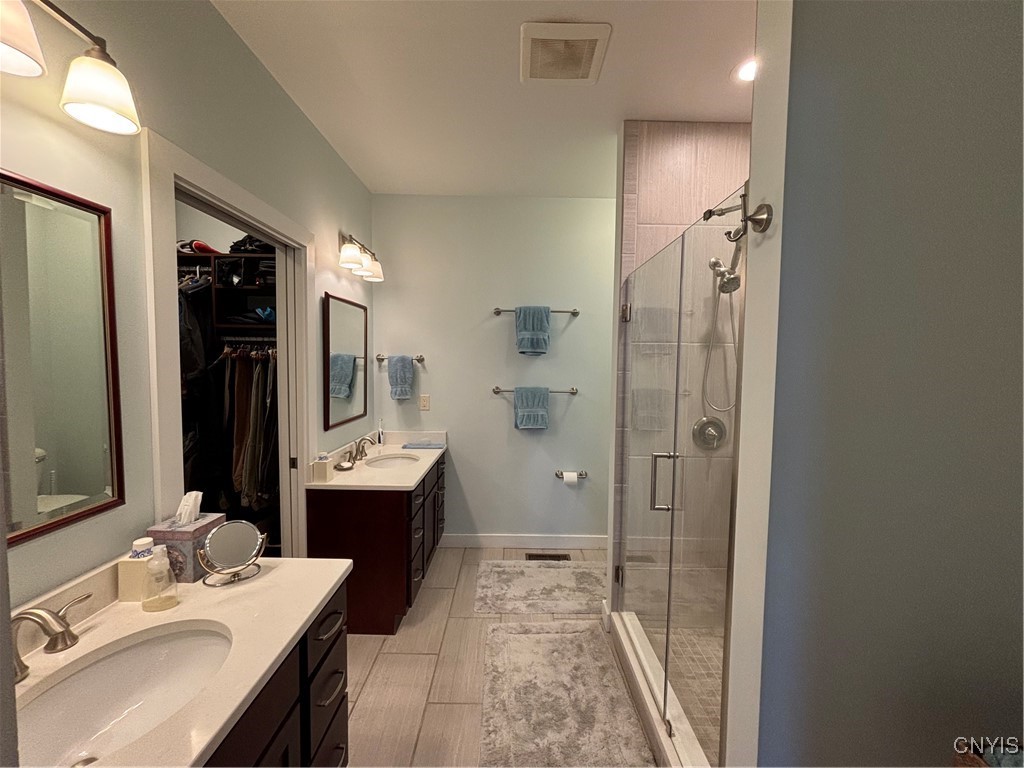 139 Burtis Point Road Owasco, NY 13021 - Photo 32 of 50 The principal bedroom's en-suite bathroom with two