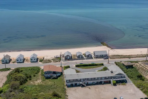 an aerial view of a house with outdoor space