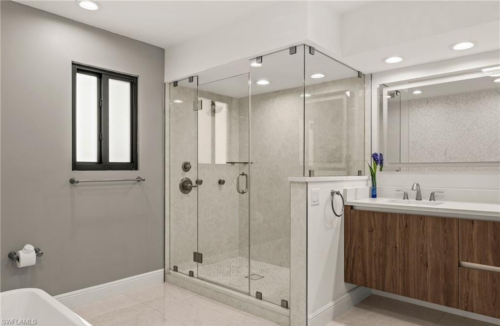 2307 Queens Way Naples, FL 34112 - Photo 22 of 41 a bathroom with a sink a toilet and shower