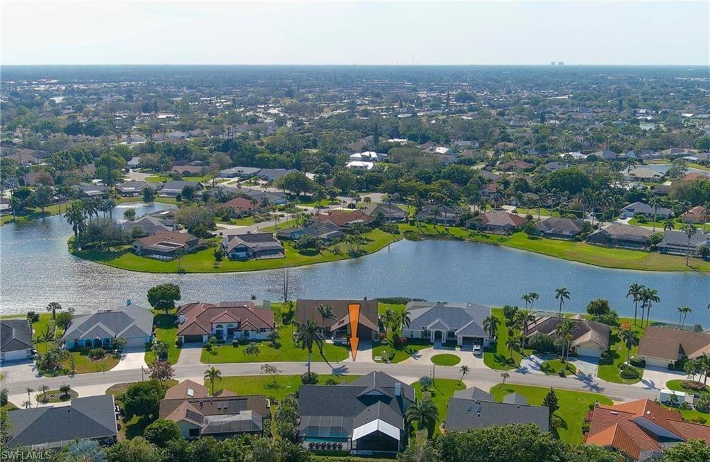 2307 Queens Way Naples, FL 34112 - Photo 40 of 41 an aerial view of a house with a swimming pool yard and outdoor seating