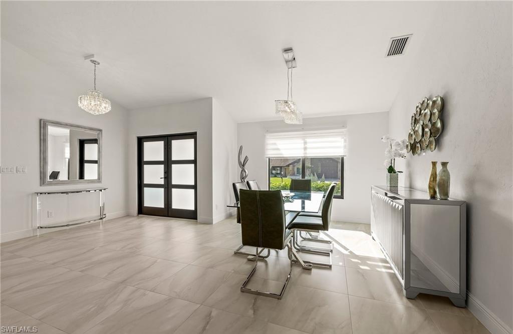 2307 Queens Way Naples, FL 34112 - Photo 6 of 41 a living room with furniture