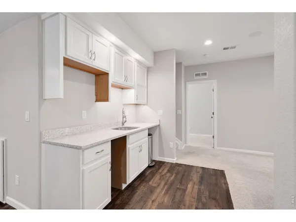 a bathroom with a sink a mirror and a vanity