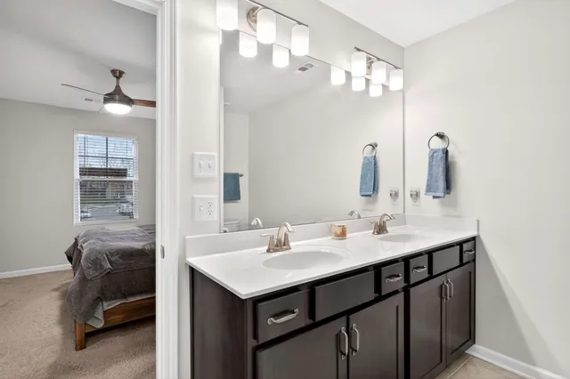 a bathroom with a sink a vanity and a mirror