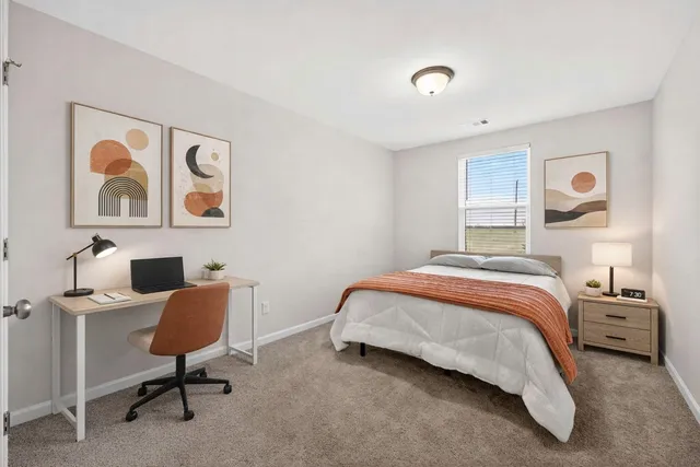 a bedroom with a bed and furniture