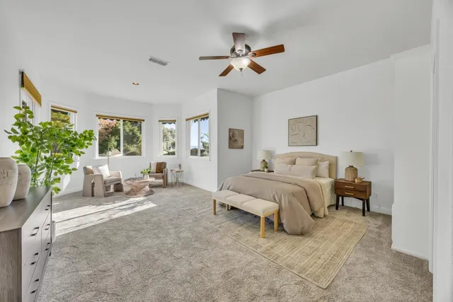 a white bath tub with a shower