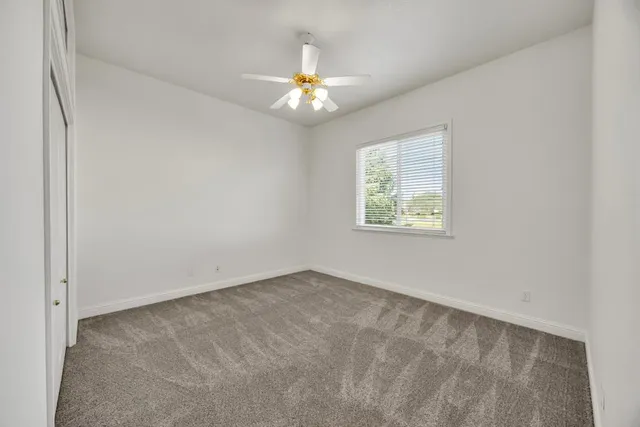 a view of a backyard with sitting area