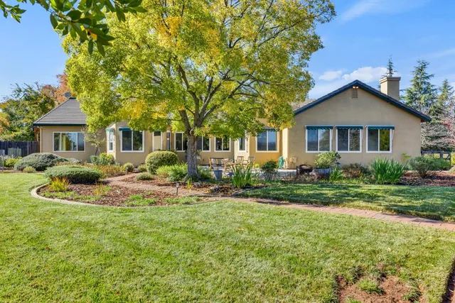a room with furniture pool table and windows