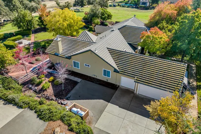 a bedroom with a bed and a ceiling fan