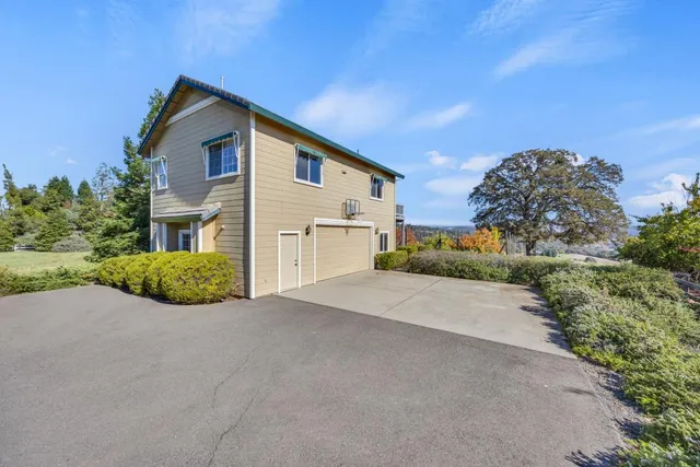 a bedroom with a bed and a ceiling fan