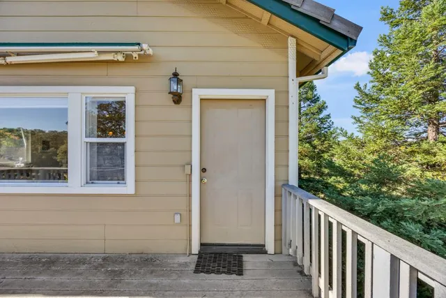 a bathroom with a granite countertop toilet a sink and a bathtub