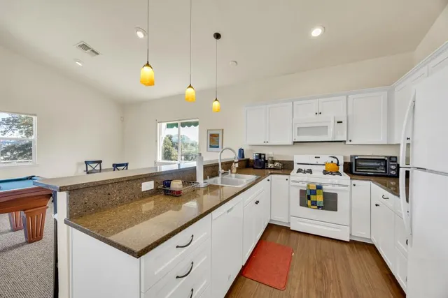 an aerial view of a house with a garden