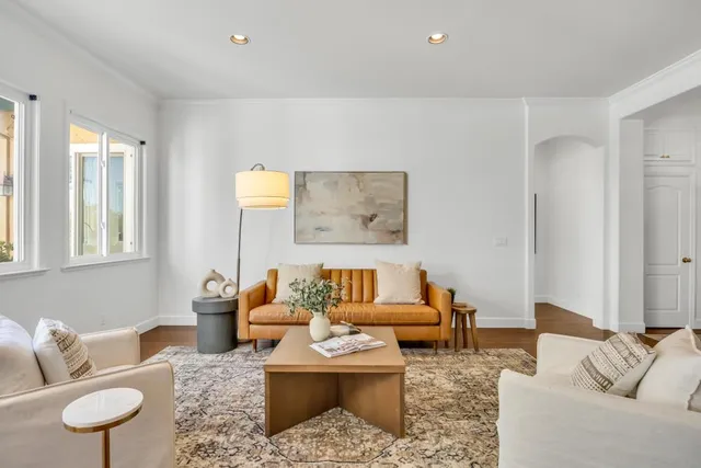 a kitchen with white cabinets and appliances