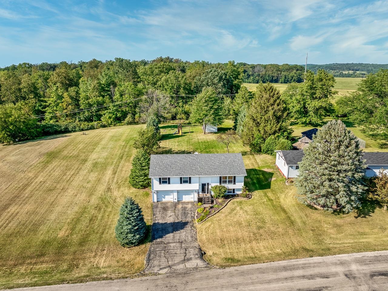1241 Lake Summerset Road Lake Summerset, IL 61019 - Photo 3 of 30 an aerial view of residential houses with outdoor space and trees