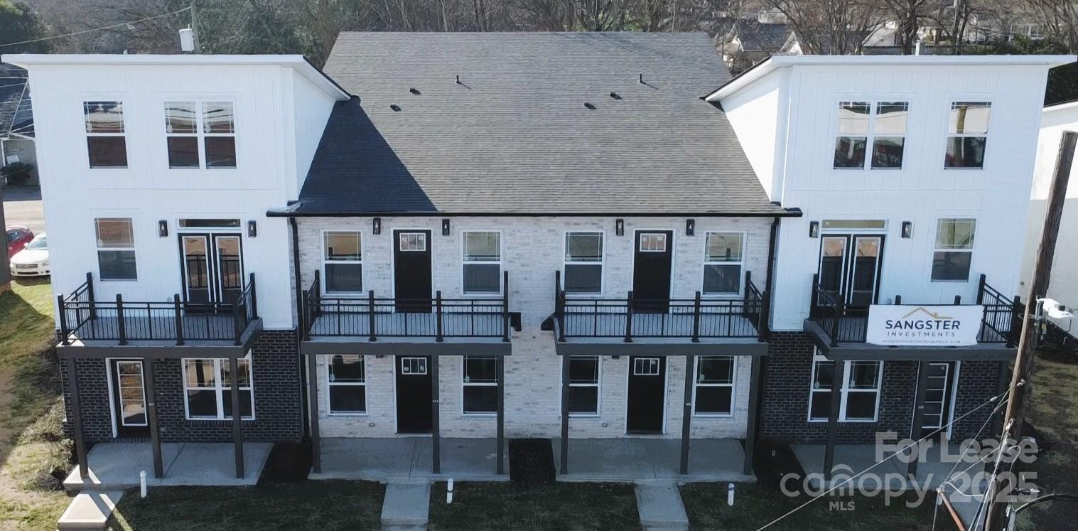 407 Church Street North Concord, NC 28025 - Photo 1 of 20 a aerial view of a large white building