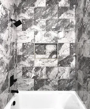 a bathroom with a bathtub and a sink