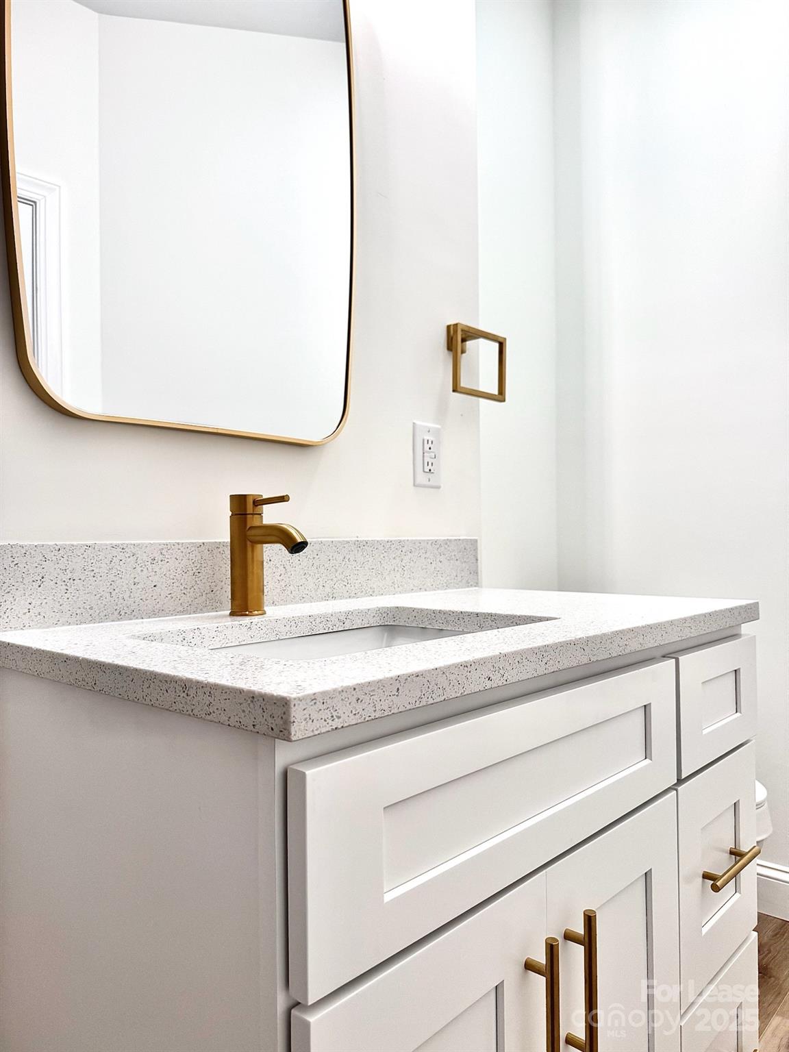 407 Church Street North Concord, NC 28025 - Photo 13 of 20 a bathroom with a sink and mirror