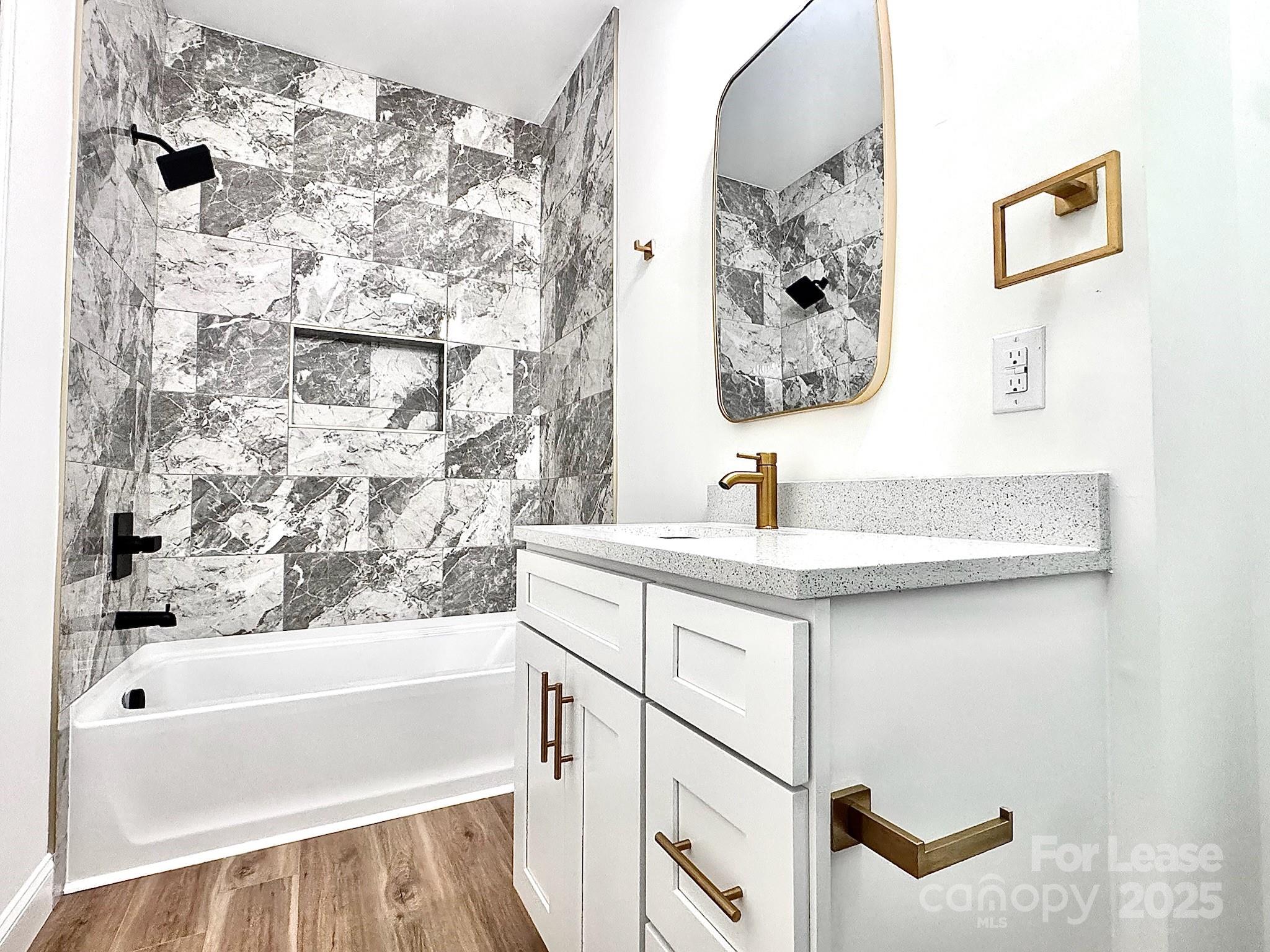 407 Church Street North Concord, NC 28025 - Photo 14 of 20 a bathroom with a bathtub and a sink