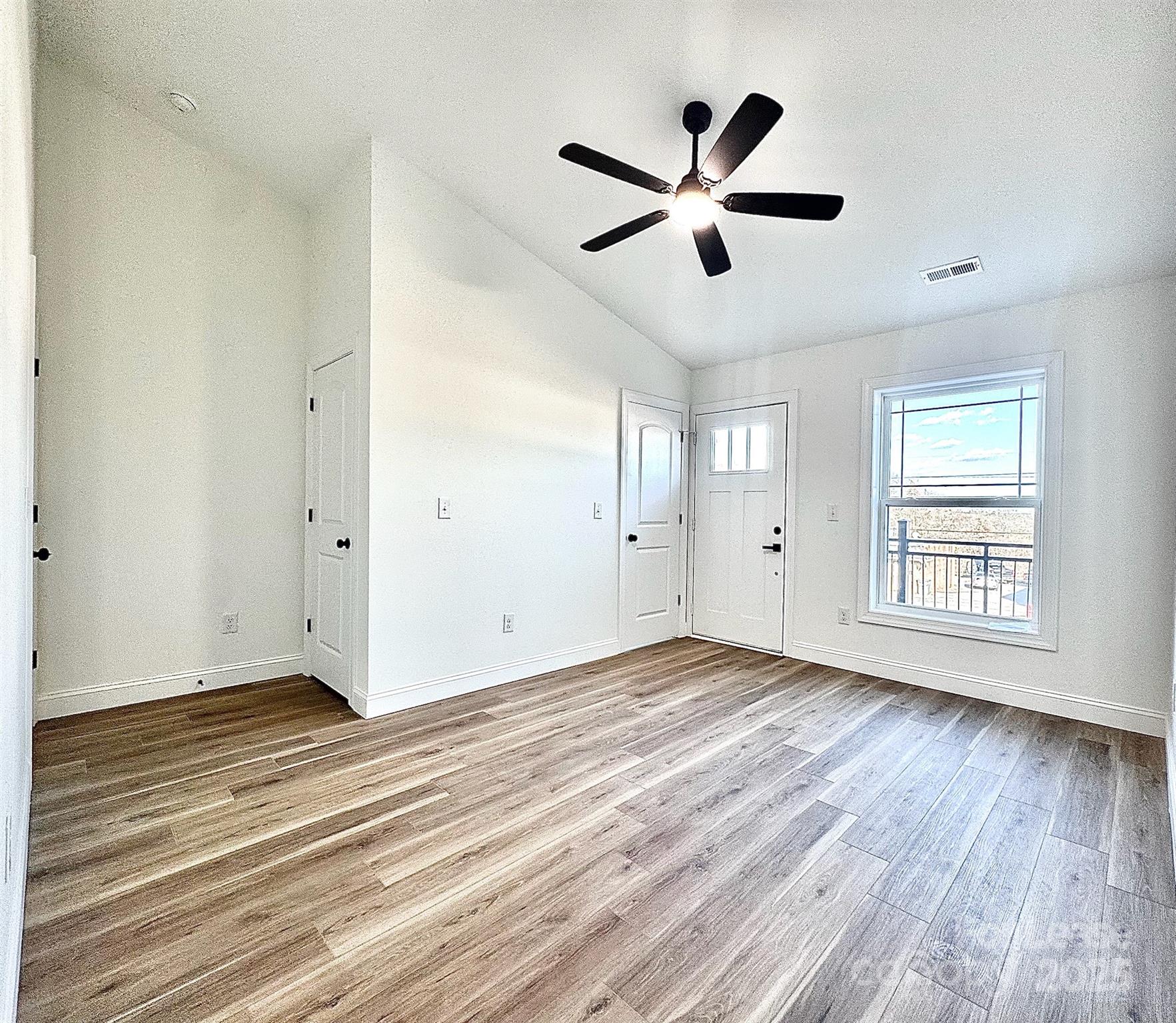407 Church Street North Concord, NC 28025 - Photo 19 of 20 a view of empty room with wooden floor and window