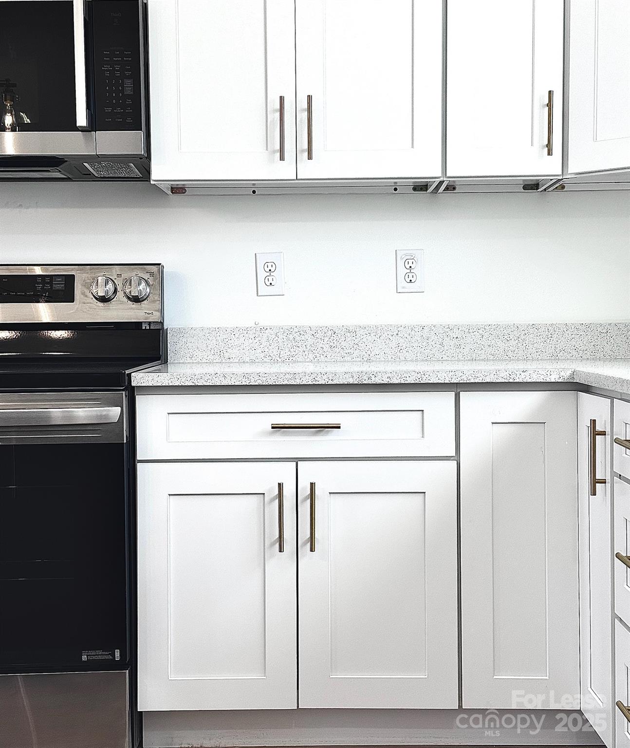 407 Church Street North Concord, NC 28025 - Photo 6 of 20 a kitchen with granite countertop cabinets stainless steel appliances and a sink
