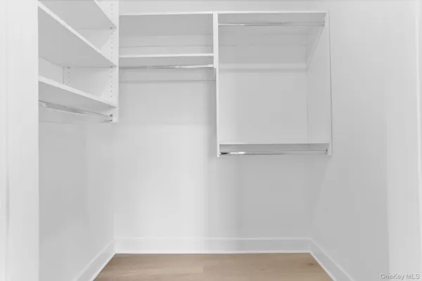 a large bathroom with a double vanity sink and a mirror