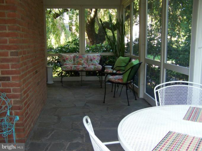 107 Bellemore Road Baltimore, MD 21210 - Photo 2 of 16 a view of a patio with lawn chairs next to a yard