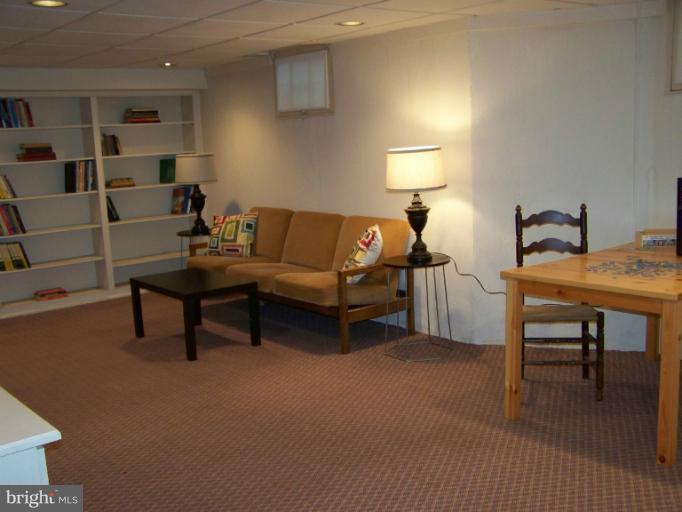 107 Bellemore Road Baltimore, MD 21210 - Photo 11 of 16 a living room with furniture and a lamp