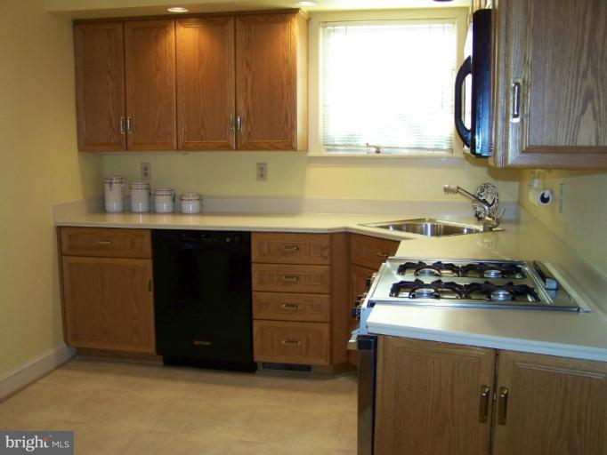 107 Bellemore Road Baltimore, MD 21210 - Photo 12 of 16 a kitchen with a cabinets and a stove