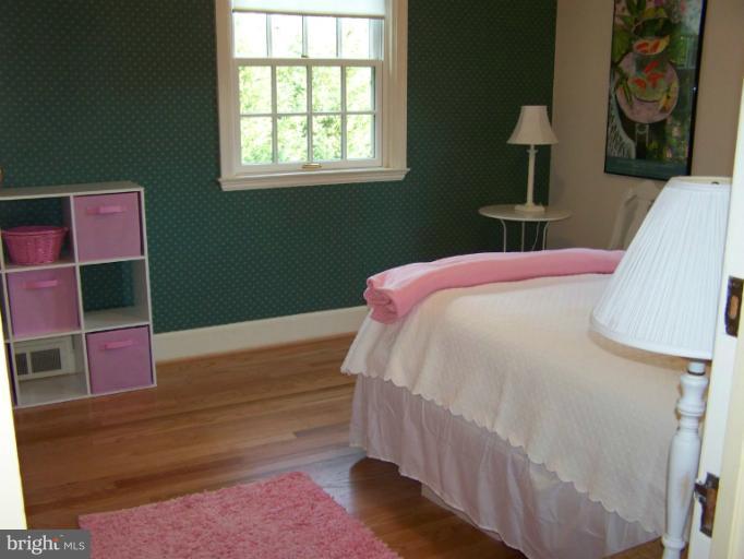 107 Bellemore Road Baltimore, MD 21210 - Photo 14 of 16 a bedroom with a bed and window