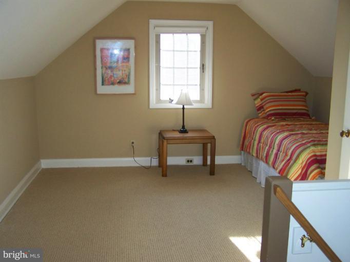 107 Bellemore Road Baltimore, MD 21210 - Photo 7 of 16 a bedroom with a bed and a window