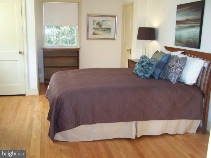 107 Bellemore Road Baltimore, MD 21210 - Photo 10 of 16 a bedroom with a bed and a window