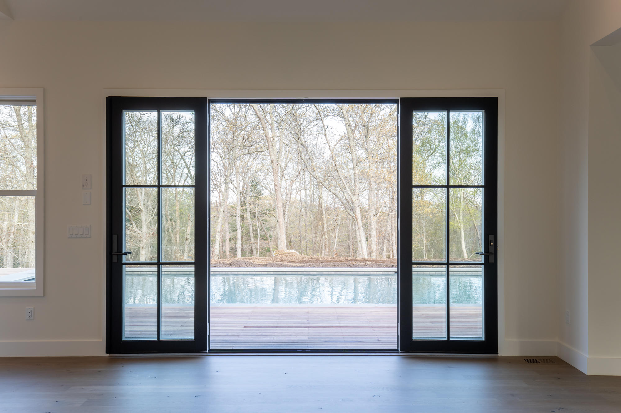 25 Luce Farm Road West Tisbury, MA 02568 - Photo 11 of 26 a view of an empty room with a large window