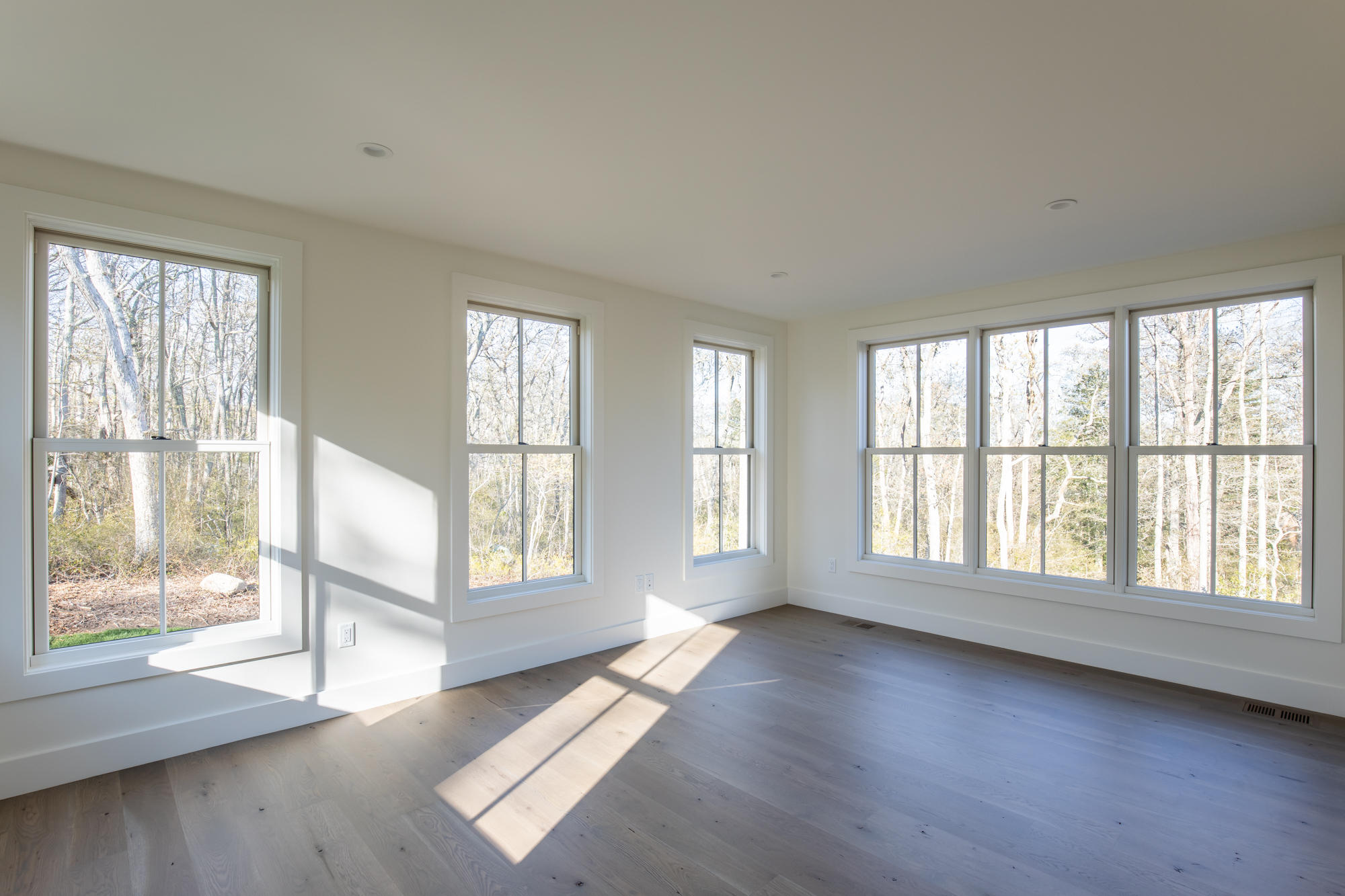 25 Luce Farm Road West Tisbury, MA 02568 - Photo 15 of 26 a view of an empty room with wooden floor and a window