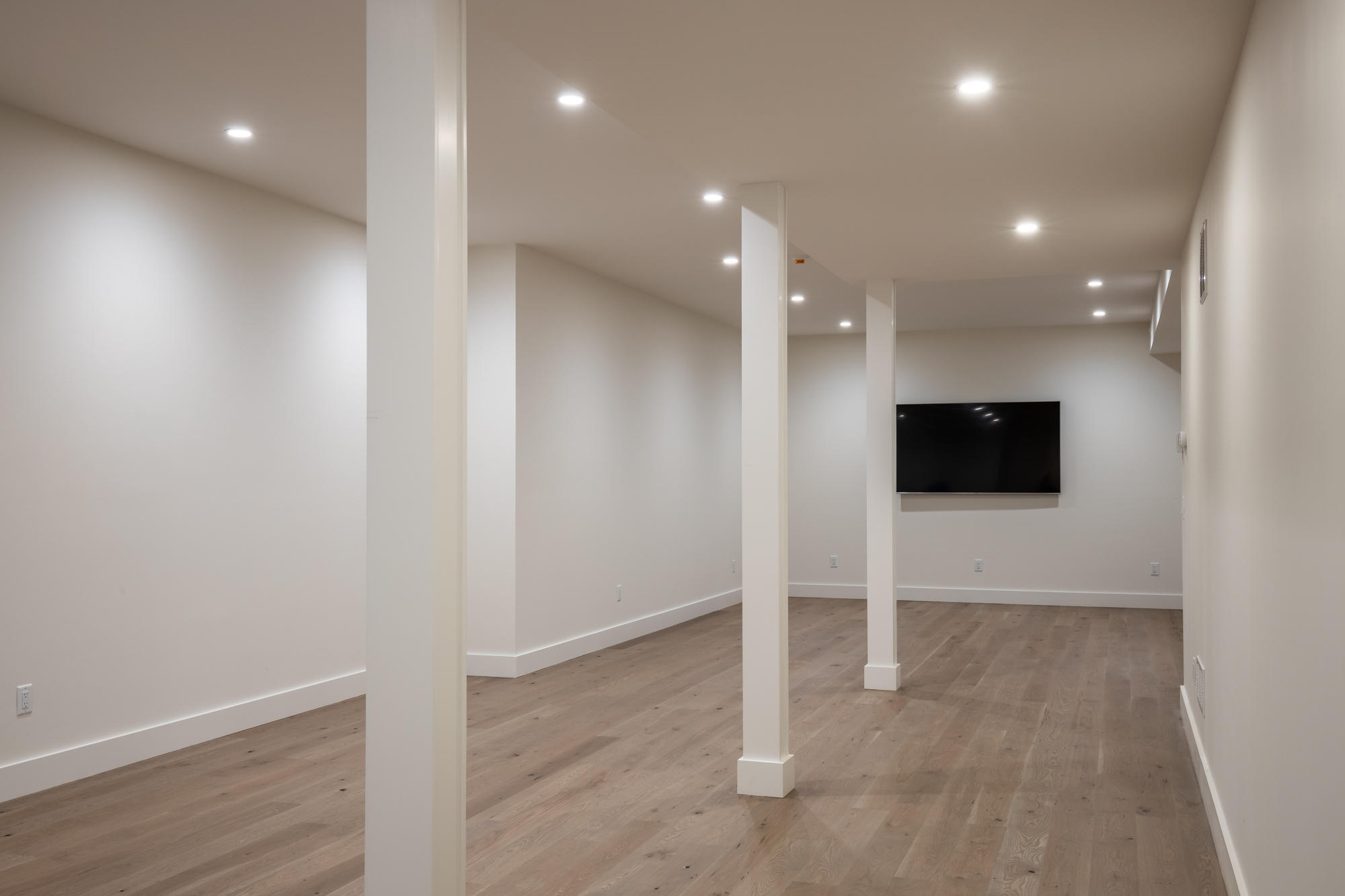 25 Luce Farm Road West Tisbury, MA 02568 - Photo 19 of 26 an empty room with wooden floor and windows