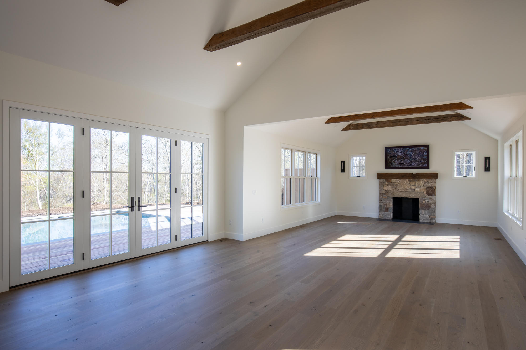 25 Luce Farm Road West Tisbury, MA 02568 - Photo 4 of 26 a view of an empty room with a fireplace and wooden floor