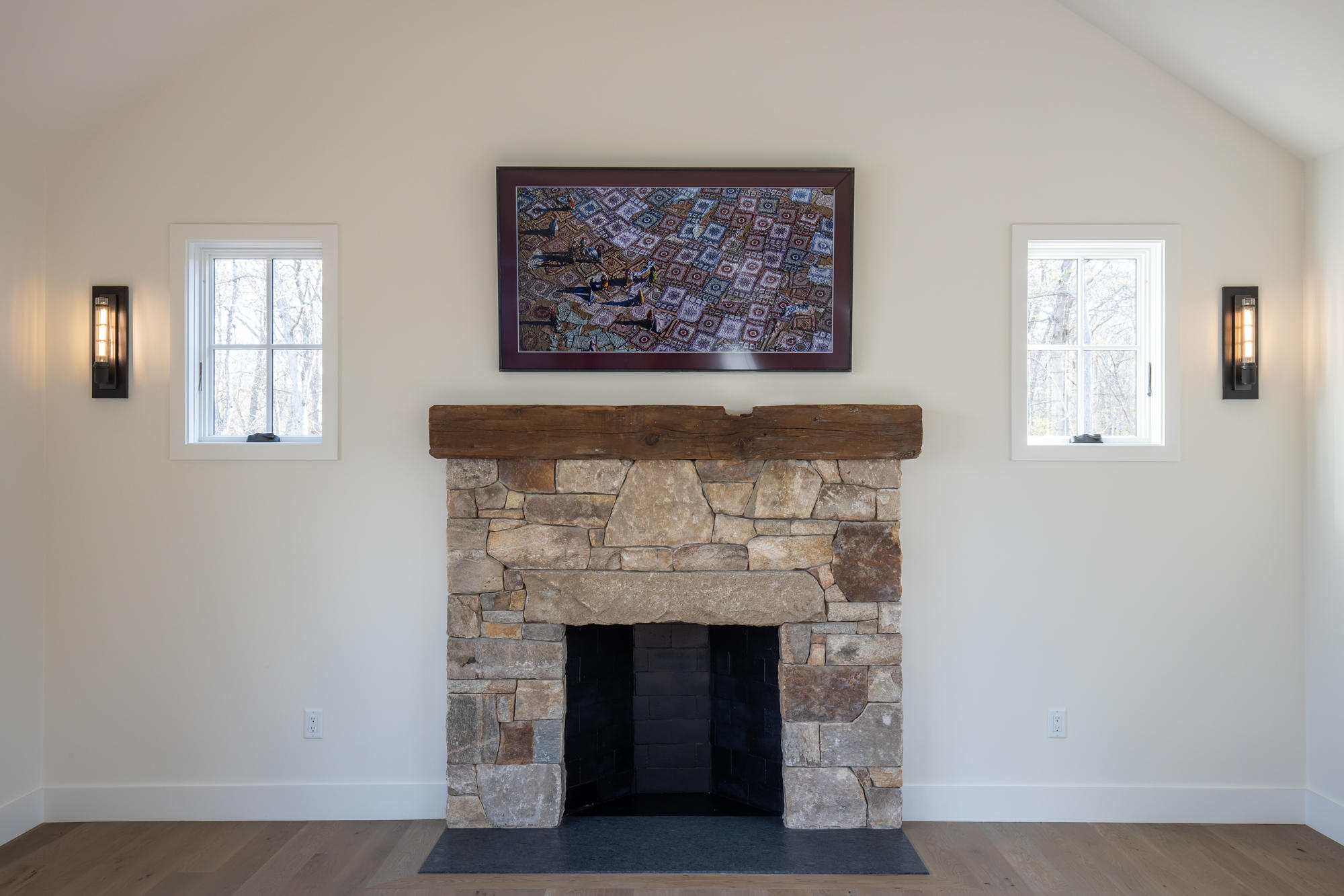 25 Luce Farm Road West Tisbury, MA 02568 - Photo 5 of 26 a living room with a fireplace and a painting