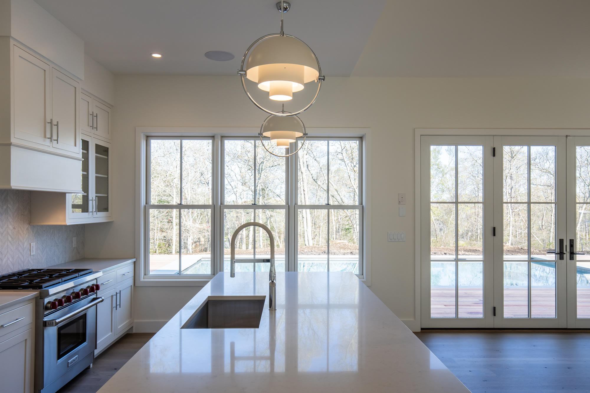 25 Luce Farm Road West Tisbury, MA 02568 - Photo 9 of 26 a kitchen with wooden floor and a window