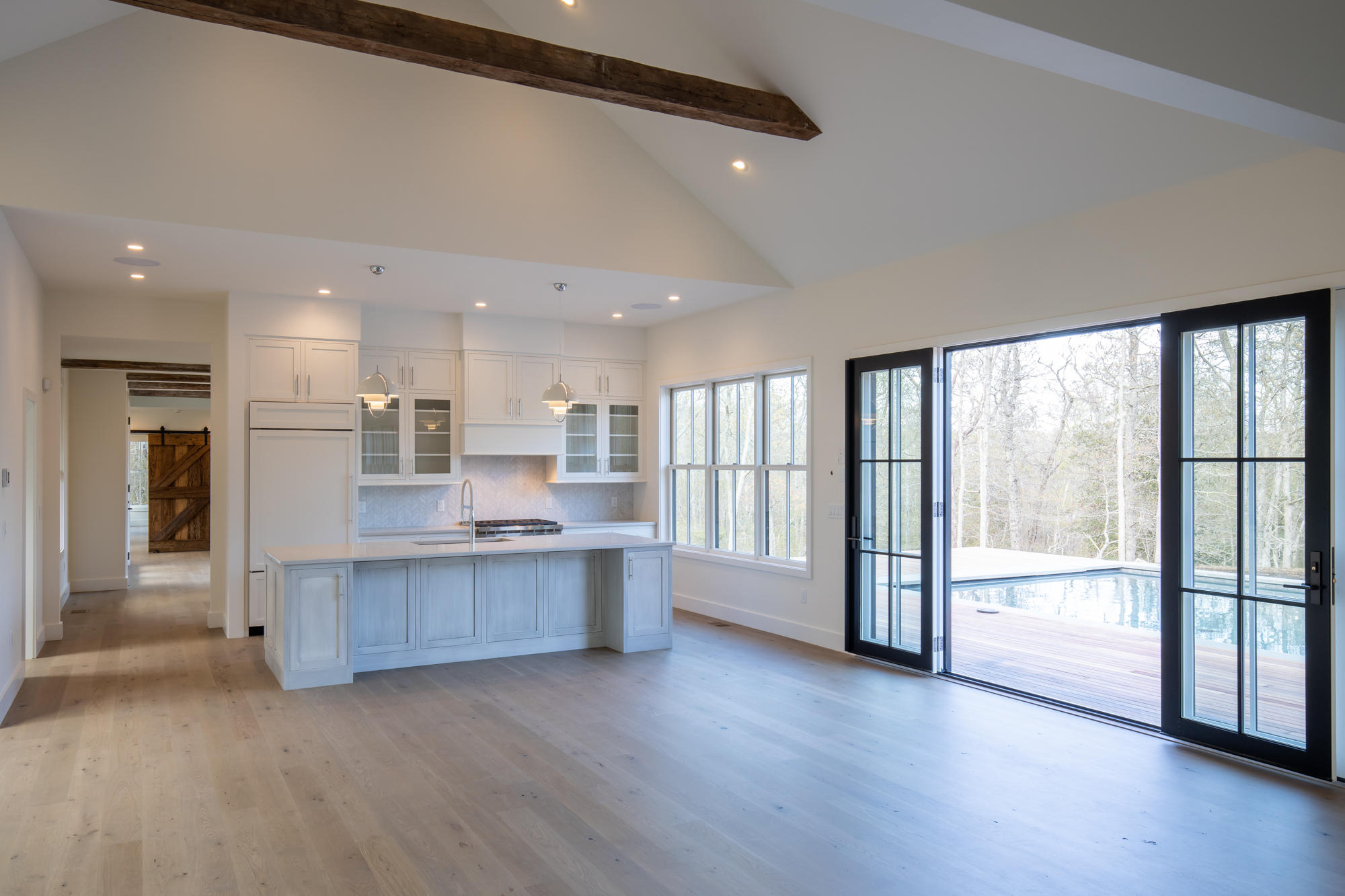 25 Luce Farm Road West Tisbury, MA 02568 - Photo 10 of 26 a large kitchen with a large window and stainless steel appliances