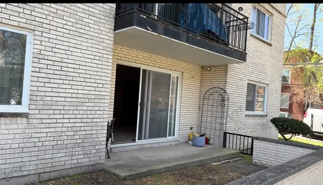 a view of a house with a yard and sitting space