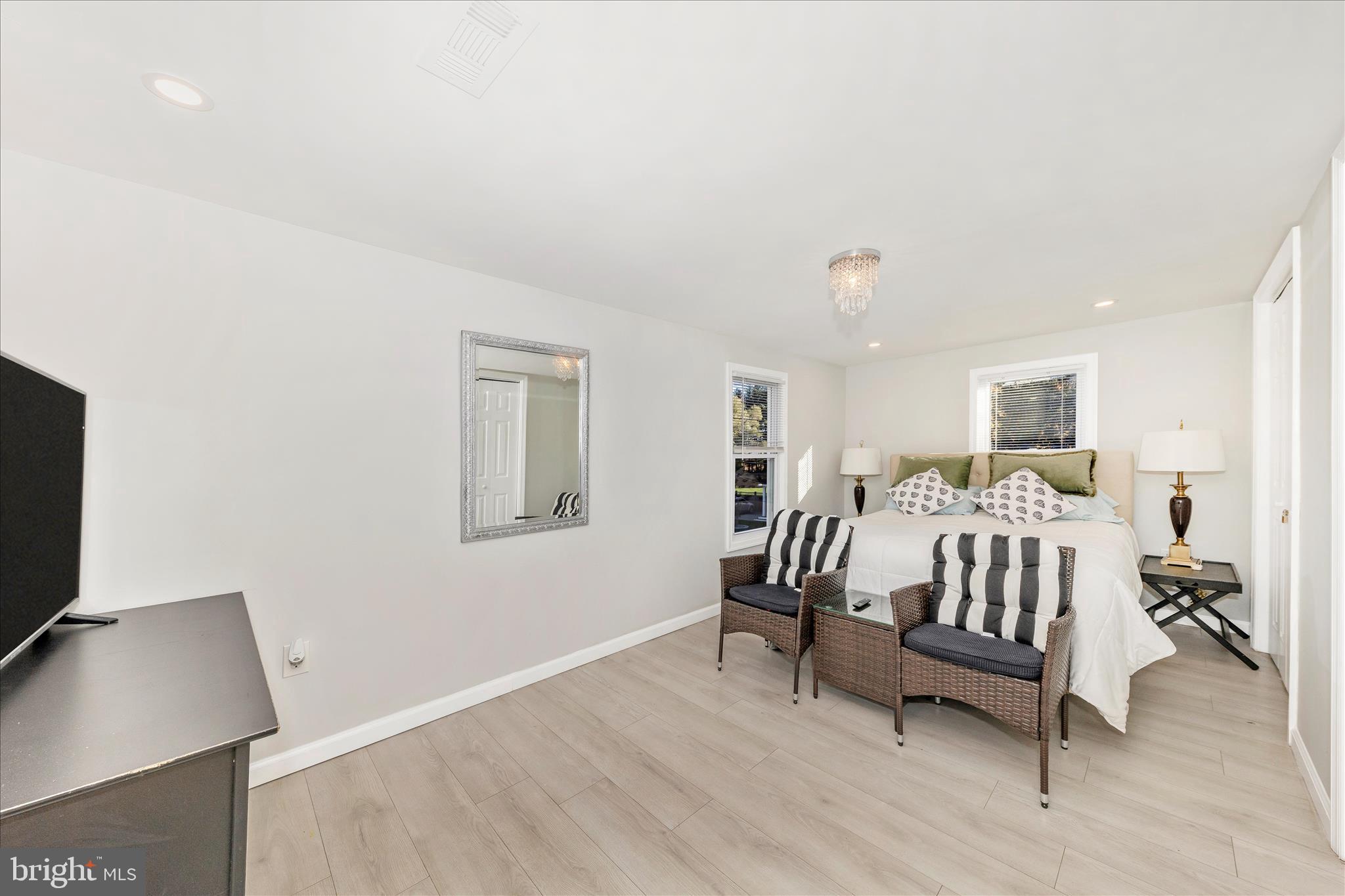 6216 Manor Woods Road Frederick, MD 21703 - Photo 18 of 45 a bed room with a bed and a chair