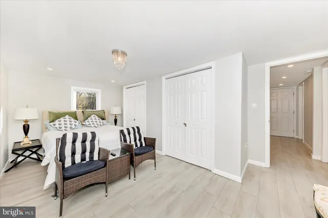 a bed room with a bed and a chair