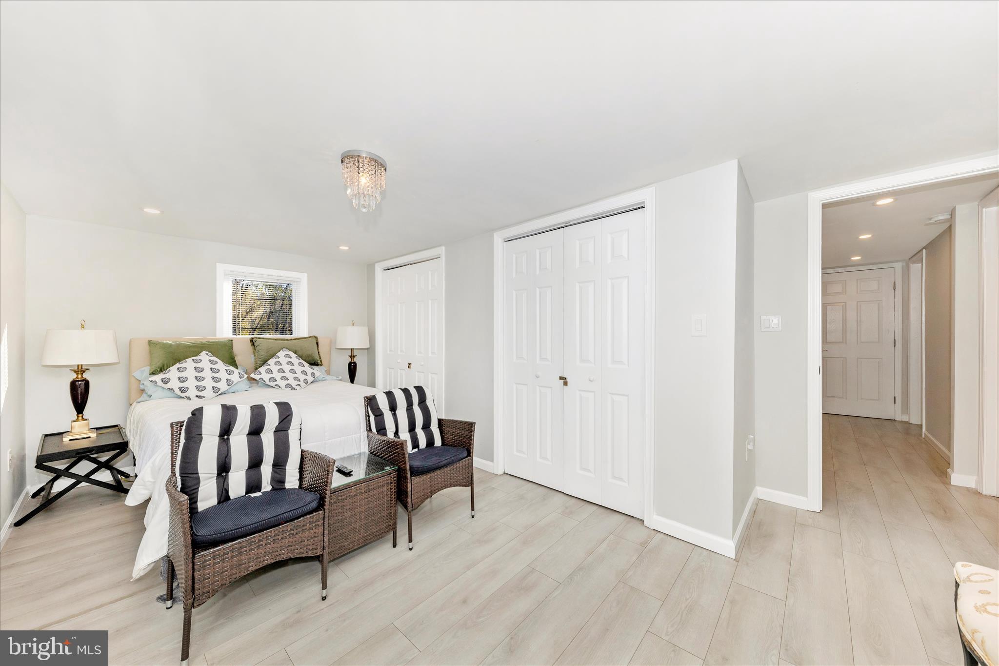 6216 Manor Woods Road Frederick, MD 21703 - Photo 19 of 45 a bed room with a bed and a chair