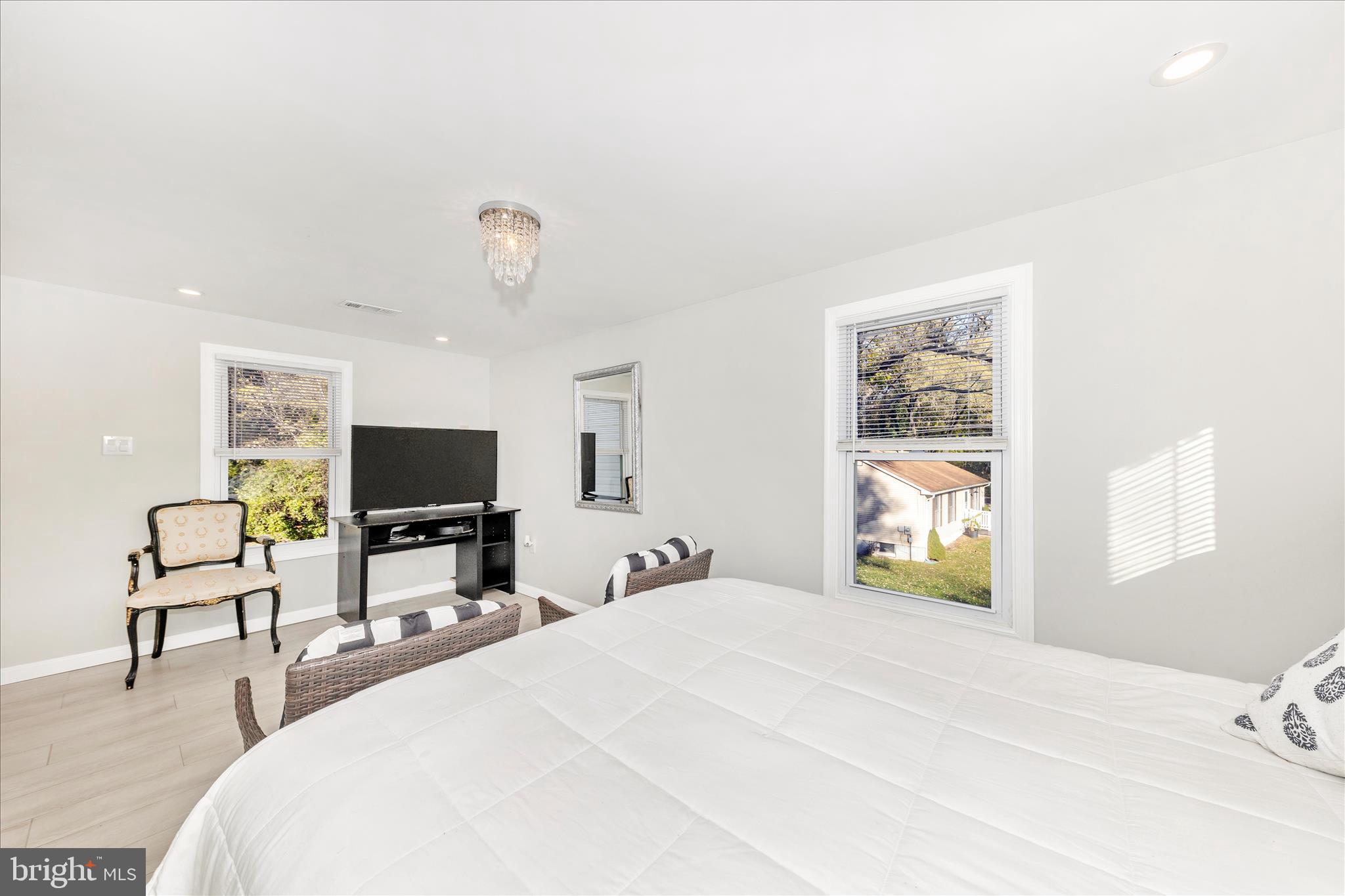 6216 Manor Woods Road Frederick, MD 21703 - Photo 20 of 45 a bedroom with a bed and a flat screen tv