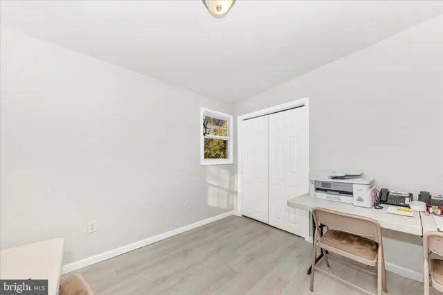 a workspace with furniture and window