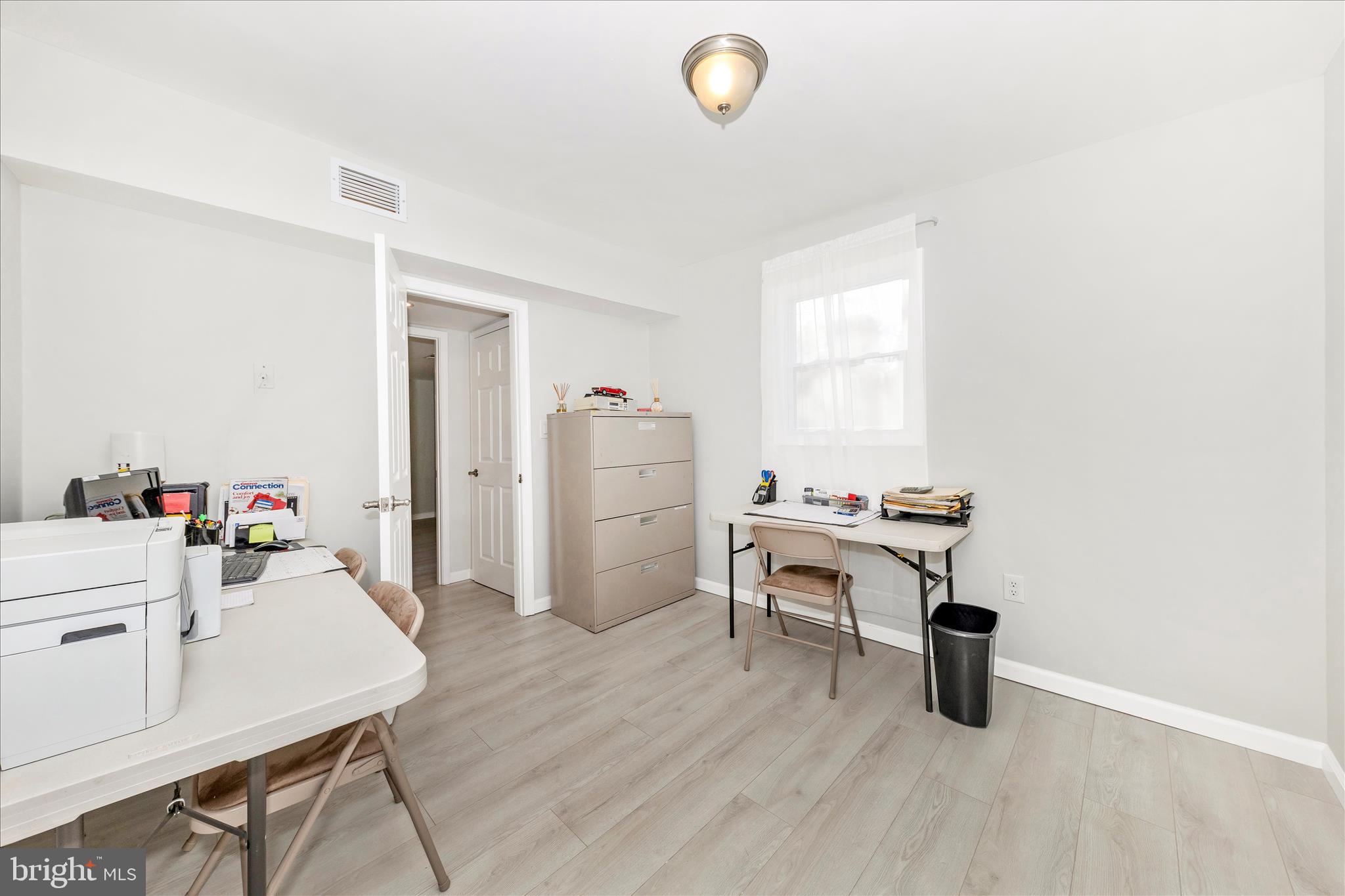 6216 Manor Woods Road Frederick, MD 21703 - Photo 24 of 45 a work room with furniture and wooden floor