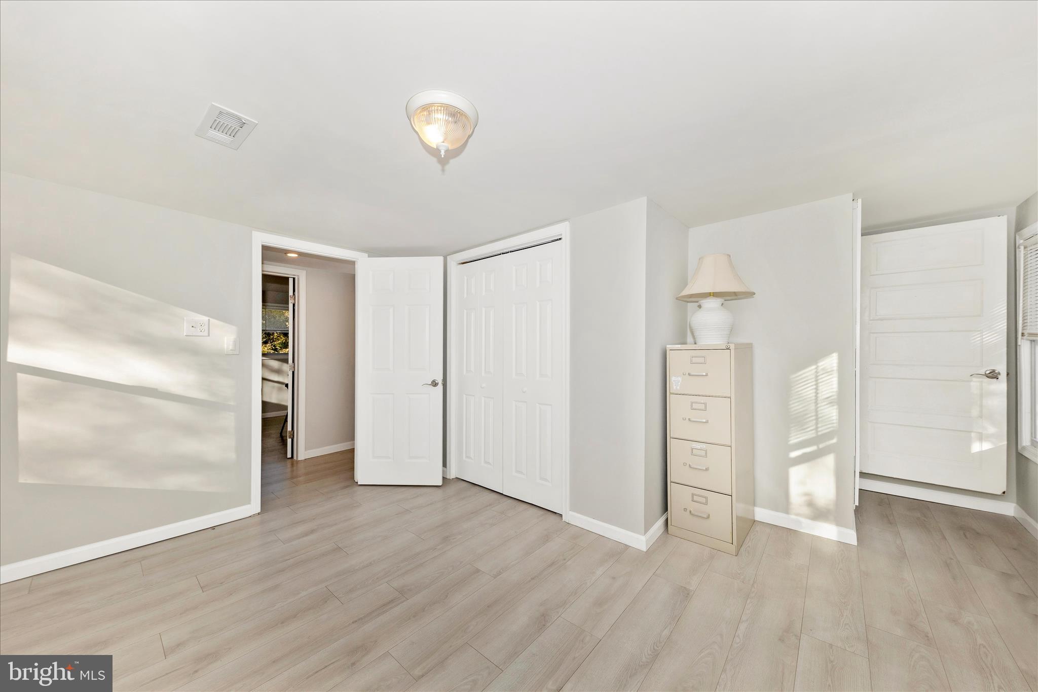 6216 Manor Woods Road Frederick, MD 21703 - Photo 28 of 45 wooden floor in an empty room